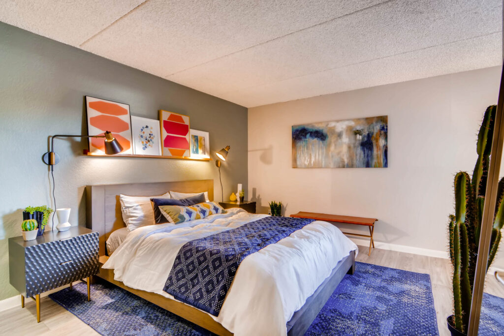 Apartment bedroom with wood-style flooring and window