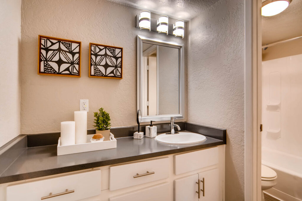 Apartment bathroom vanity with cabinets and drawers