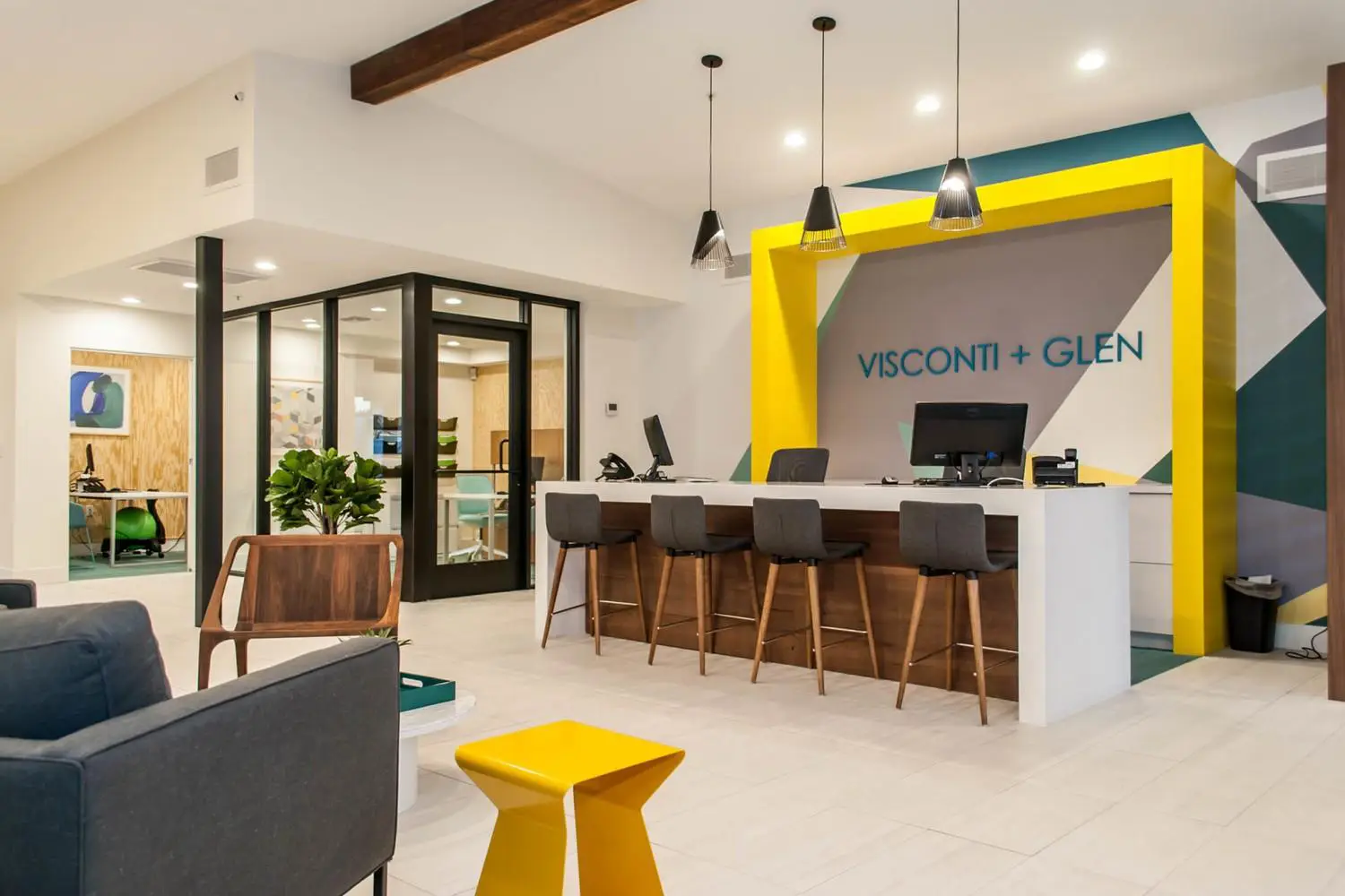 Visconti and Glen Apartments leasing office with barstool seating, lounge areas, and private offices