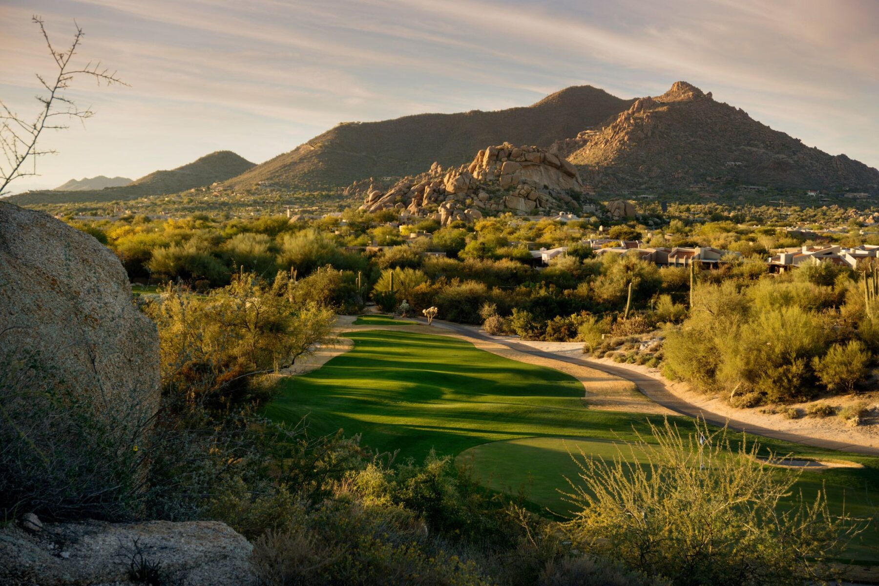 Golf course with mountains in the background